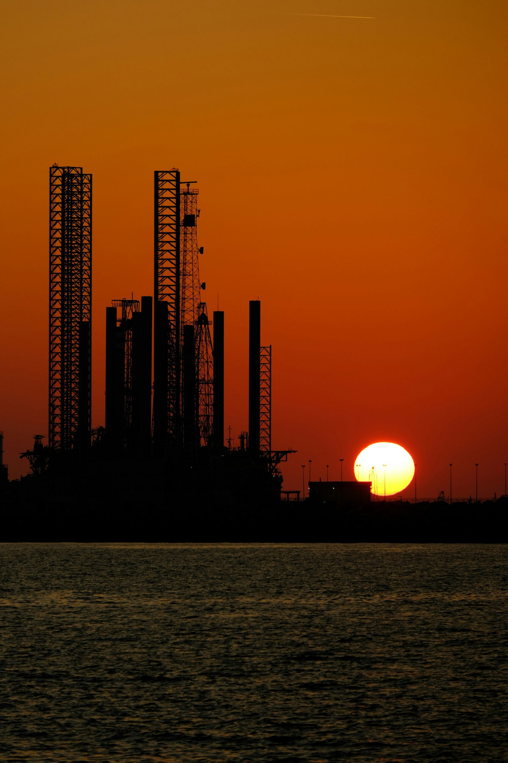 Gloved hand working with cell culture samples in a lab setting.